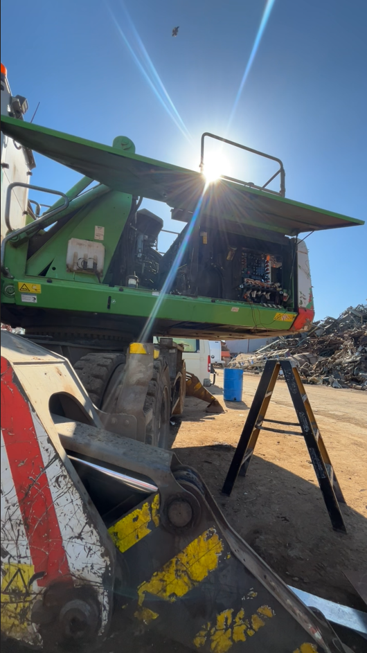 Mobile engineer installing electrical controls onsite in FNQ